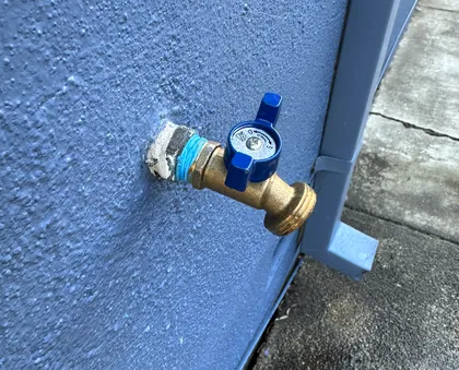 An outdoor hose bib replaced with a quarter-turn ball-valve faucet for reliable shutoff
